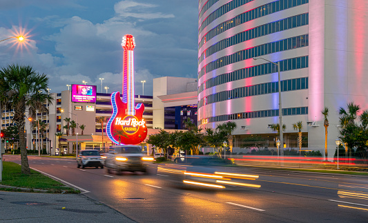 Biloxi, Mississippi, USA - June 30, 2021: Biloxi strip with casinos including Hard Rock, with street motion blur.