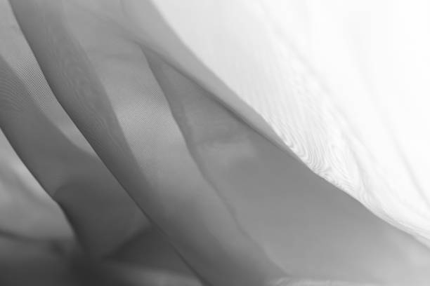 istock Wavy white tulle with soft shadows. Background 1349798359