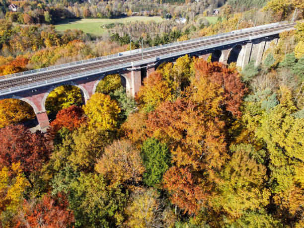 istock Trees in autumn at the goeltzschtalbruecke 1349802202