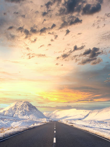 istock Buachaille Etive Mor mountain and empty road covered in snow during winter 1349803668
