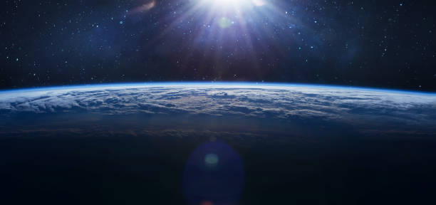 istock Earth in the outer space. Orbit of planet. Sun light and stars on background. Milky way. Elements of this image furnished by NASA 1349803800