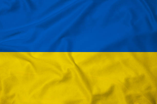 Flag of Ukraine Flag of Ukraine, background with fabric texture ukrainian language stock pictures, royalty-free photos & images
