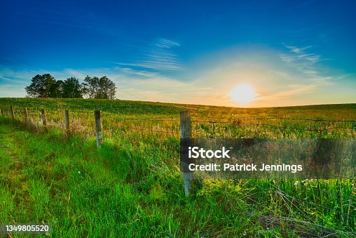 istock Sunset over a Open Field. 1349805520