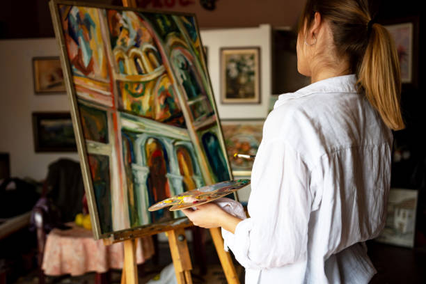 istock Young female artist working 1349806761
