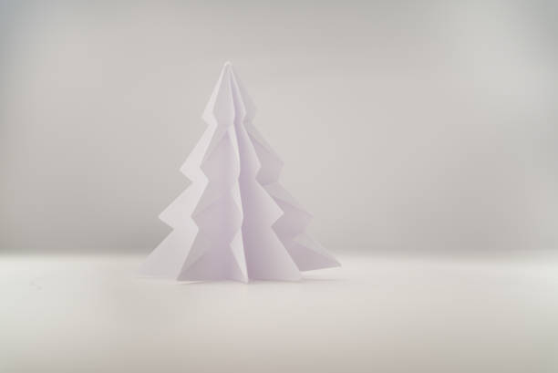 istock tree made of paper, origami spruce pine on a white background 1349808518