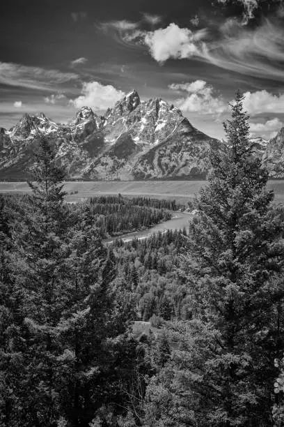 Photo of The Grand Teton mountains with the Sanke River, Wyoming.