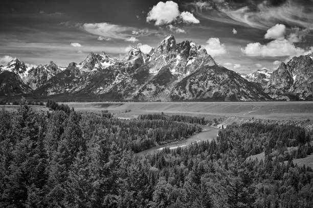 Photo of The Grand Teton mountains with the Sanke River, Wyoming.