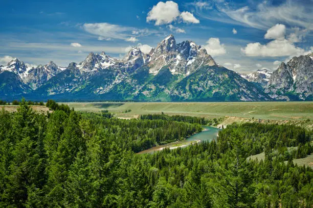 Photo of The Grand Teton mountains with the Sanke River, Wyoming.