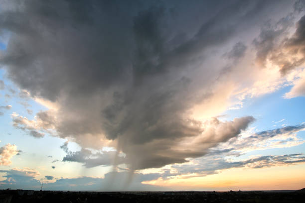 istock Landscape of dark clouds forming on stormy sky during thunderstorm. 1349809542