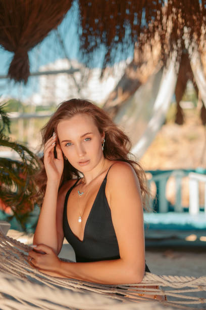istock beautiful woman in black bikini 1349811984