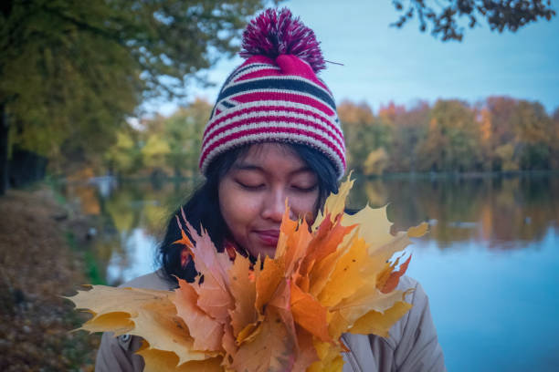 istock Girl in a beautiful autumn park 1349813037