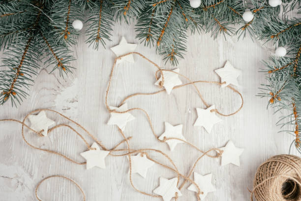 Step-by-step Christmas cold porcelain garland tutorial. Step 17: Once dry, string on rope or ribbon and garland is ready stock photo