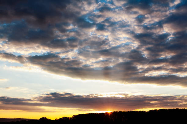 istock Spectacular sunset with altocumulus clouds on the sky 1349813477