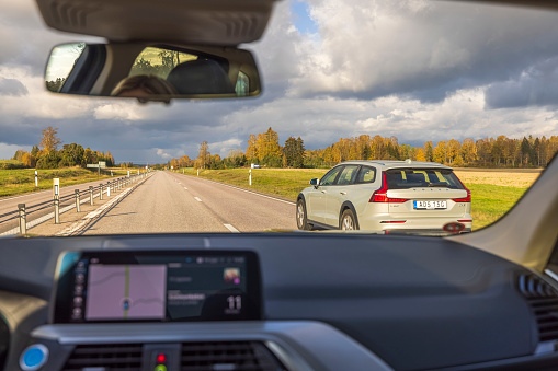 Sweden. Uppsala. 10.28.2021. View from vehicle forward to highway. Transportation concept.