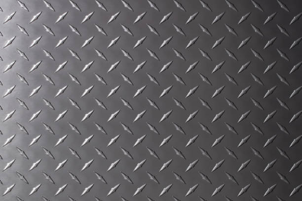 istock dark steel plate with diamond print. gray metal texture. 1349814193