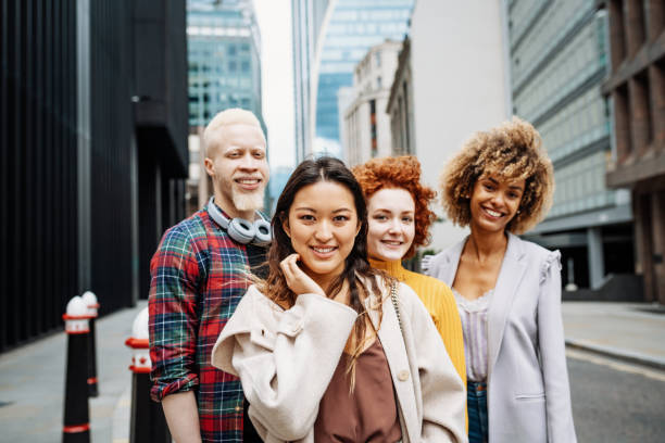 istock Multi ethnic group of young people outdoors, after reopening, looking at camera 1349815702