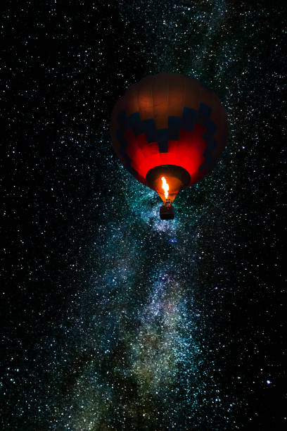 istock Balloon flying in the night sky. 1349816393