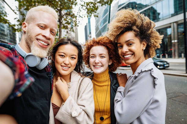 istock Multi ethnic group of young people outdoors, after reopening 1349816395