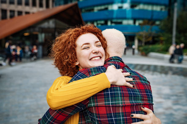 istock Beautiful diverse couple sharing emotions and hugging 1349816396