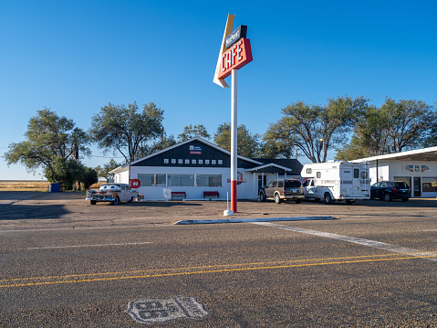 Adrian, Texas USA - October 23, 2021: Cars are parked out front of the Historic MidPoint Cafe. The Cafe is located at the halfway point between Chicago and Los Angeles on Historic Route 66.