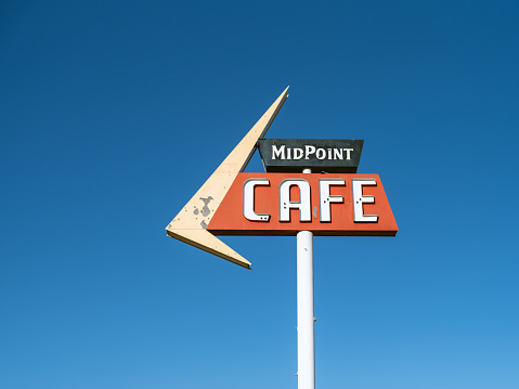 Adrian, Texas USA - October 23, 2021: MidPoint Cafe sign for the MidPoint Cafe. The sign is located at the halfway point between Chicago and Los Angeles on Historic Route 66.