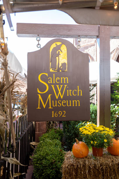 Sign at Salem Witch Museum Salem, Massachusetts USA - October 23, 2021: Sign at the entrance of the Salem Witch Museum. Salem is famous for the Witch trials of 1697. salem massachusetts stock pictures, royalty-free photos & images