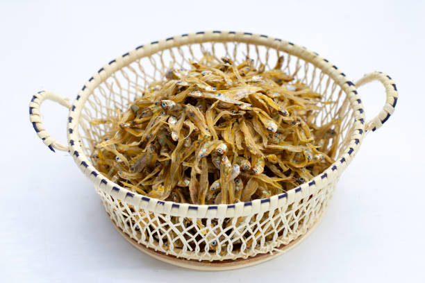 istock Dried anchovy in bamboo basket on white 1349826147