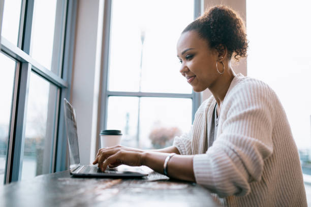 istock Woman Working On Laptop At Cafe 1349829902
