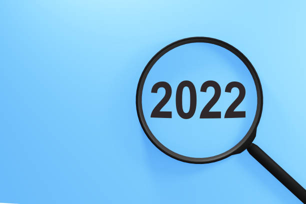 istock Magnifying glass with the word 2022 on blue background 1349830549