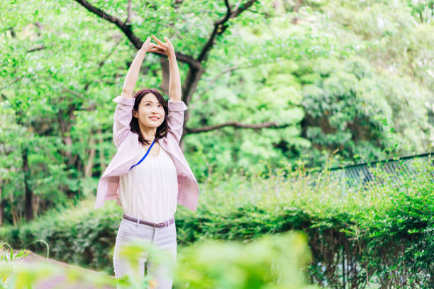 istock Business woman refreshing herself outside 1349839378