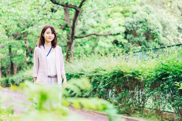 istock Business woman refreshing herself outside 1349839383