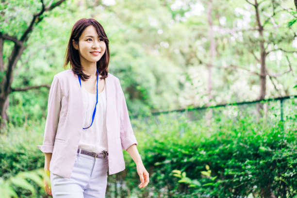 istock Business woman refreshing herself outside 1349839389