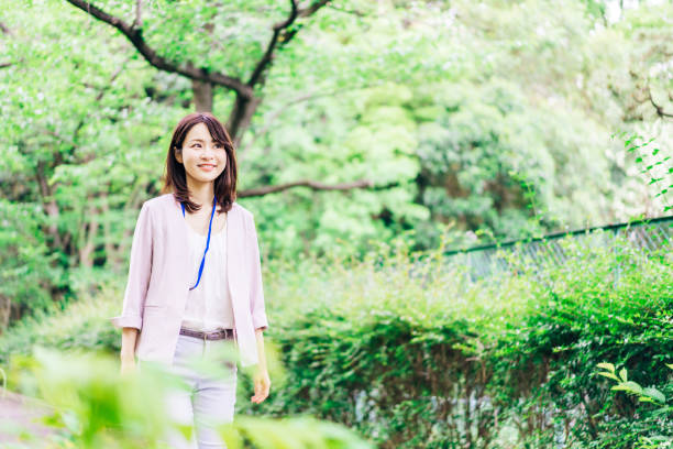 istock Business woman refreshing herself outside 1349839390