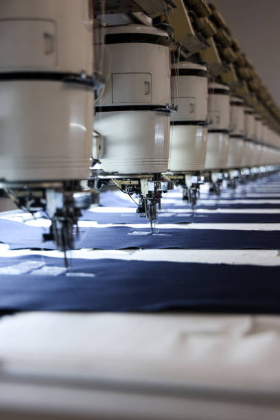 Automated textile machine Automated textile machine textile industry textile thread industry stock pictures, royalty-free photos & images