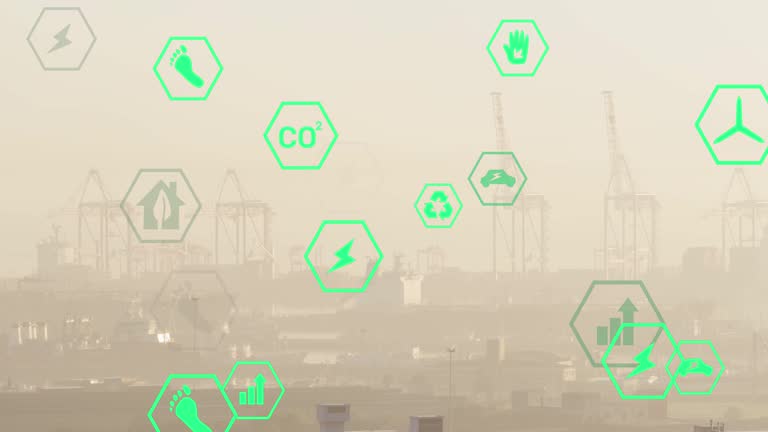 Multiple green energy icons floating against aerial view of cityscape