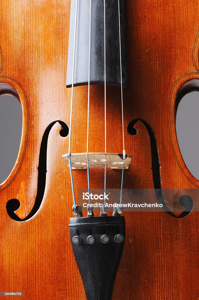 Violin Violin on the gray background illuminated with studio light Antique Stock Photo