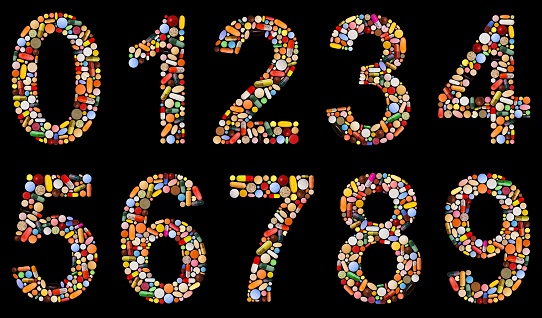 Numbers 0 to 9 on black, made of assorted, colorful pills