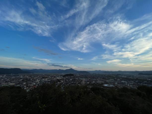istock small town landscape with mountains in the background. 1349858520