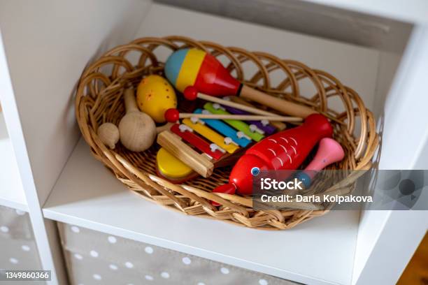 Wooden Colored Musical Instruments In A Wicker Basket Montessori Material Home Schooling Concept Stock Photo - Download Image Now