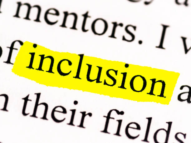 Inclusion Close up picture of a document about social justice. This photo spotlights the word inclusion. This would be a perfect hero image for a blog, presentation, website or social media. Diversity, equity & inclusion DEI. social inclusion photos stock pictures, royalty-free photos & images
