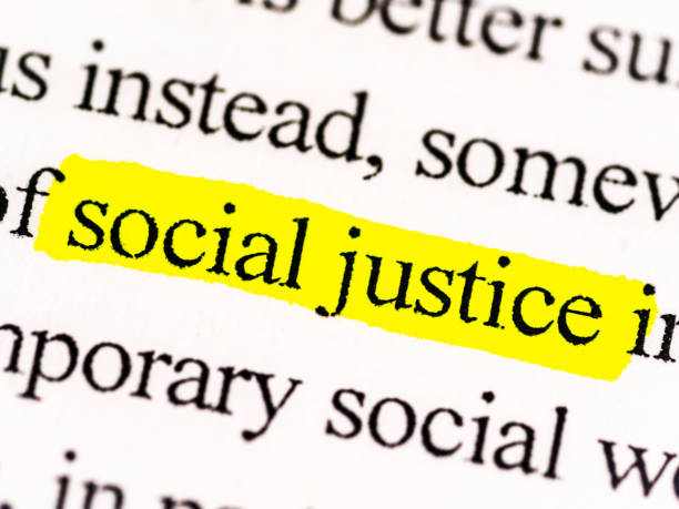 Social Justice Close up picture of a document about social justice. This photo spotlights the words social justice. This would be a perfect hero image for a blog, presentation, website or social media. Diversity, equity & inclusion DEI. social justice concept stock pictures, royalty-free photos & images