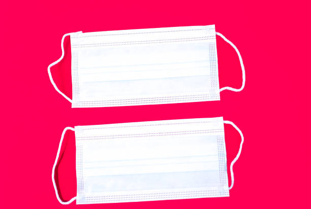 istock Two Face/Surgical Masks, Red Background 1349870978