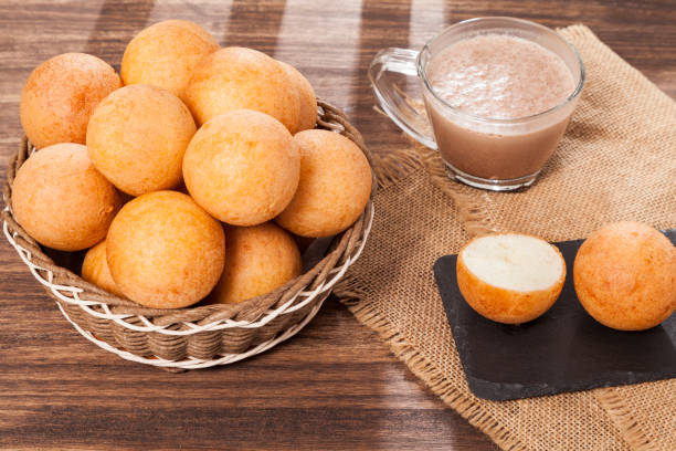 Buñuelo; Traditional Food Colombian - Deep Fried Cheese Bread With Hot Drink Buñuelo; Traditional Food Colombian - Deep Fried Cheese Bread With Hot Drink. beignet stock pictures, royalty-free photos & images