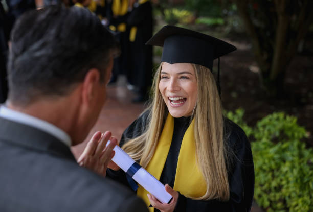 istock Graduating student talking to her father and looking very happy 1349878784