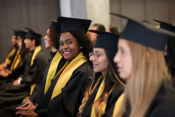 istock Happy graduate smiling at the camera during her graduation ceremony 1349878786