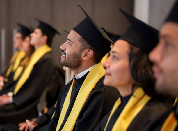 istock Graduate student smiling in his graduation ceremony 1349878793