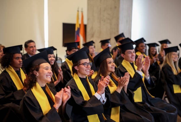 istock Happy students applauding in their graduation ceremony after the commencement speech 1349878818