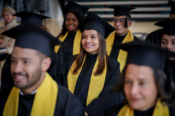 istock Happy female student smiling in her graduation ceremony 1349878827