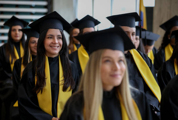 istock Happy female student smiling in her graduation ceremony 1349878837