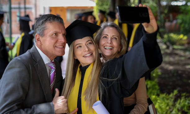 istock Graduate student taking a selfie with her parents on her graduation day 1349878861